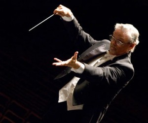 A conductor leads a musical performance