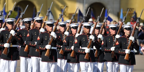 A platoon of Marines in dress uniforms march in formation, and this depicts why every business needs a strategic staffing plan