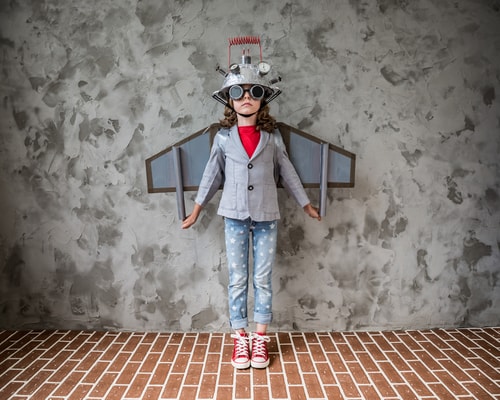 A boy is dressed up as an airplane that depicts secrets to stimulate innovation in your business