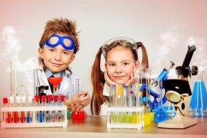 Two kids with a chemistry set signifies how to turbocharge your business experiments