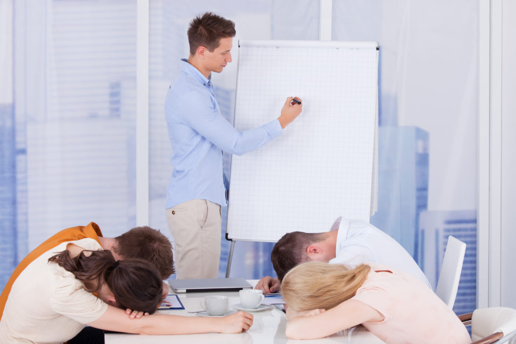 You are Doing it Wrong: Tips for Running Effective Meetings depicted by a leader writing on the board while four attendees are napping.