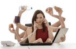 An 8 armed woman worker multitasks instead of learning 10 no-nonsense tips for being more productive