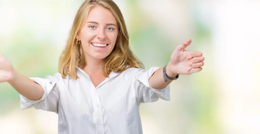 A young woman smiles and greets the viewer with open arms. Why is forgiveness so hard?