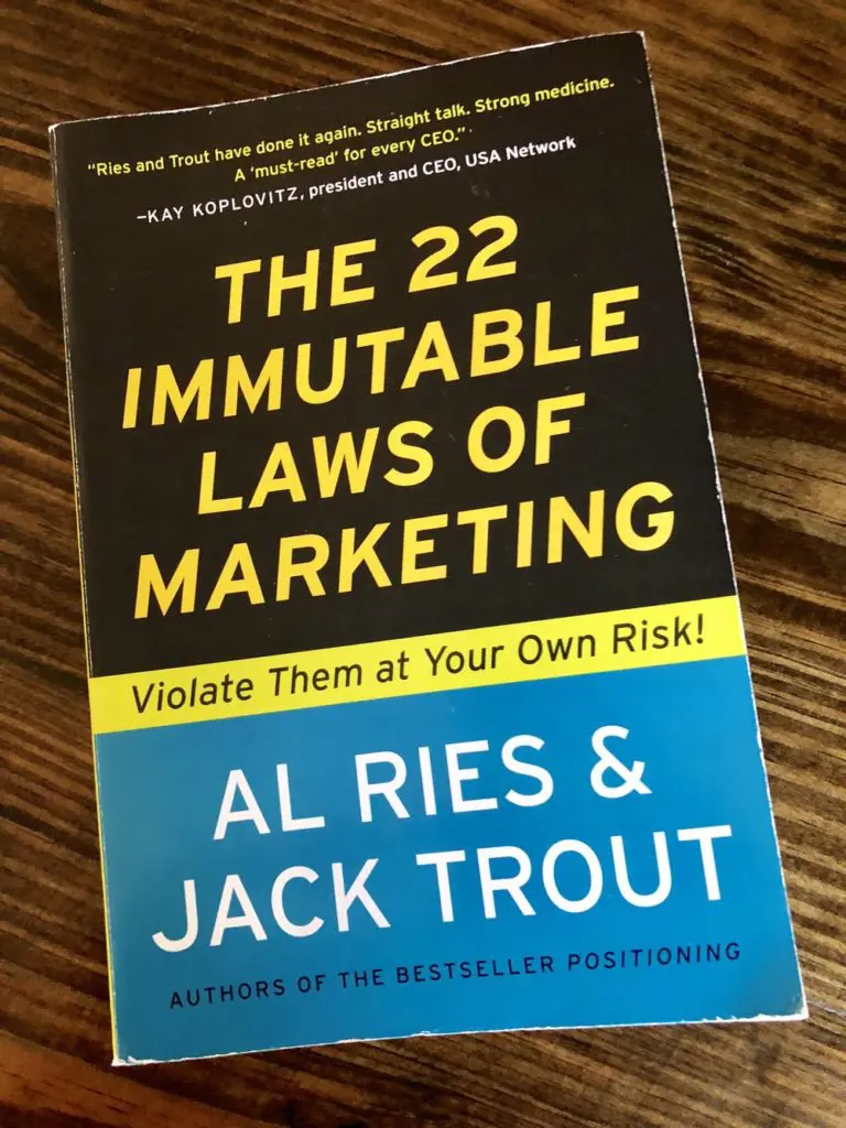 A photo of the cover of the Ries and Trout book titled The 22 Immutable Laws of Marketing
