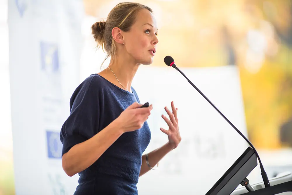 Pretty, young business woman giving a presentation of a new business idea