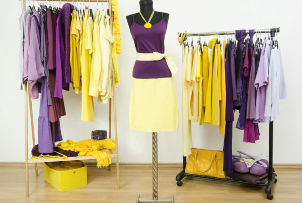 A photo of an array of stylish women's clothes tastefully merchandised.