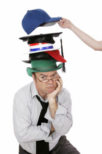  A leader wearing a stack of different hats depicting the complications of time management