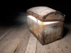 A photo of a treasure chest slightly open and glowing with promise and leadership advice