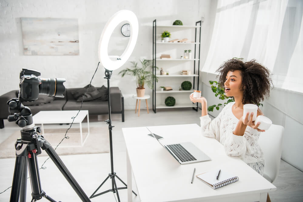 A woman influencer pitches a product on camera