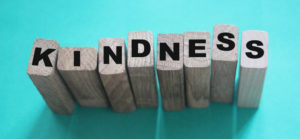 Wooden blocks spell out kindness