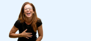 a photo of a laughing woman that depicts a highly interpersonal manager