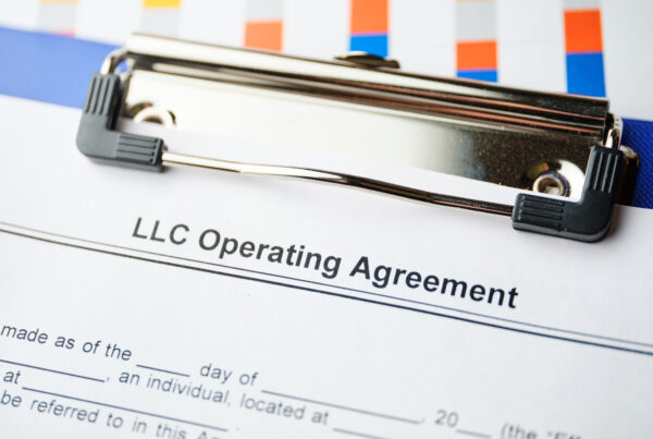 Legal document LLC Operating Agreement on paper.