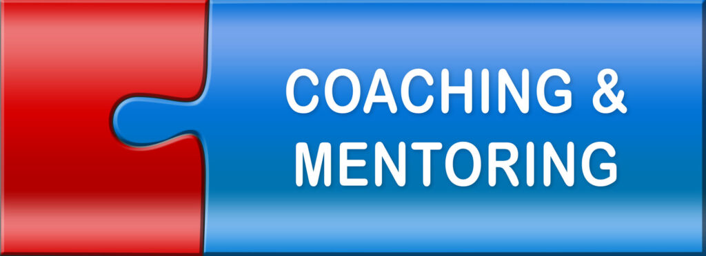 Two interlocking puzzle pieces that read coaching and mentoring