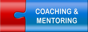 Two interlocking puzzle pieces that read coaching and mentoring