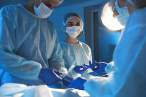 A junior Dr. teaches a fellow Dr. after she watched a Sr. Dr. perform the surgery