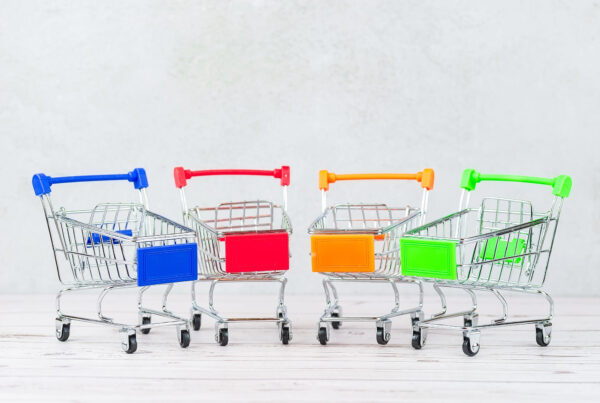 Four shopping carts in a semi-circle depicting the power of data analytics