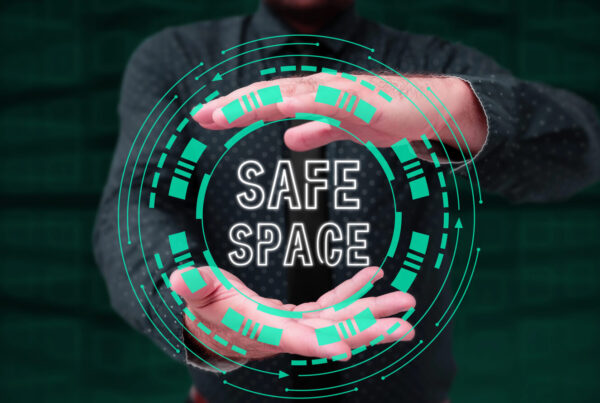 A graphic of a man's hands holding a circle that says safe place