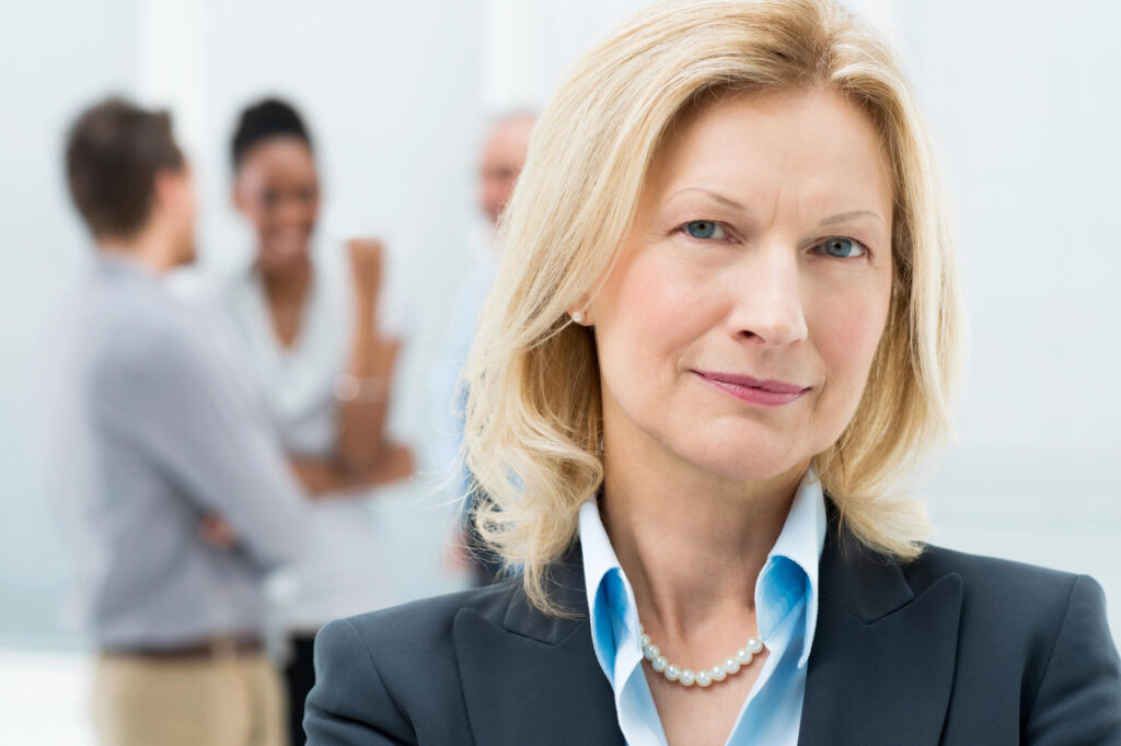 A photo of a middle-aged professional woman who looks like a General Manager
