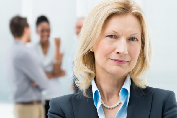 A photo of a middle-aged professional woman who looks like a General Manager
