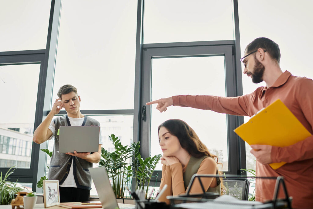 A small business CEO directs two of his teammates.