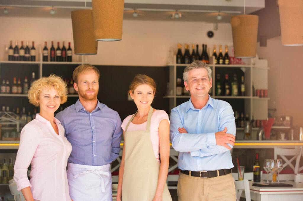 Four family members stand together in their business